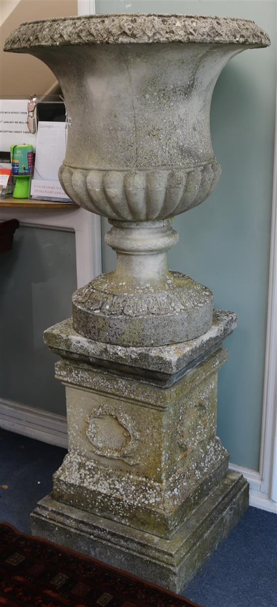 A large garden urn on on pedestal base W.approx. 80cm